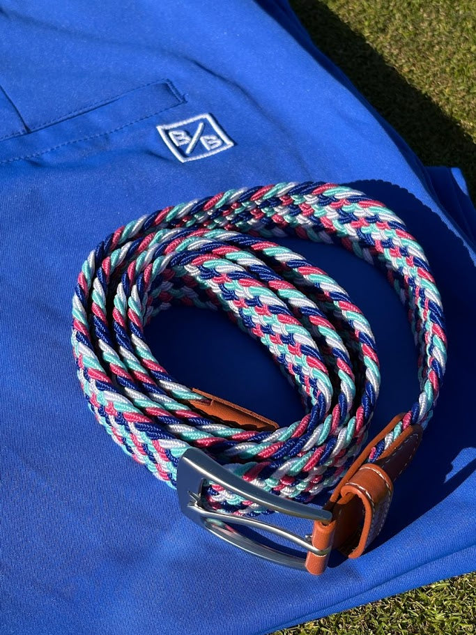 Colorful braided belt on a blue shorts with a brand logo